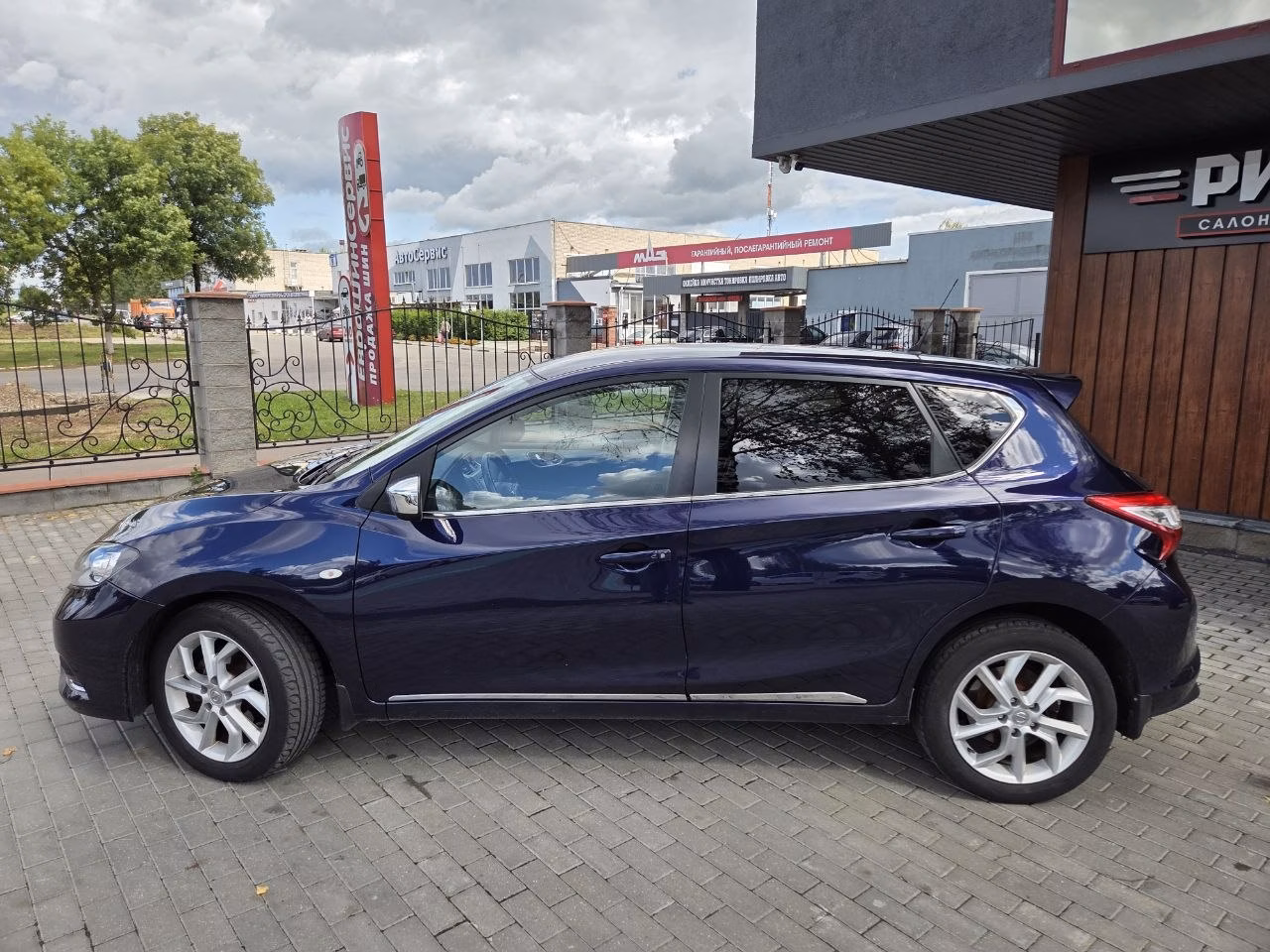 Nissan Tiida фото 8